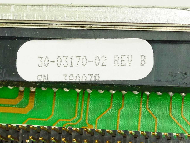 Close-up of sticker label on card edge reading 30-03170-02 REV B with serial number