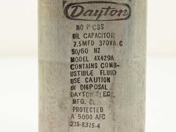 Dayton 4X429A oil capacitor — close-up of label reading 7.5 MFD 370 VAC 50/60 Hz, No PCBs, 5000 AFC, 235-8315-4