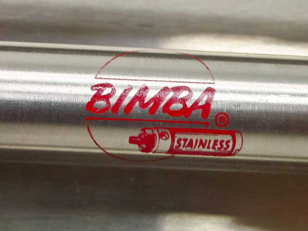 Close-up of Bimba Stainless label on cylinder body — red circular logo with text 'BIMBA STAINLESS'