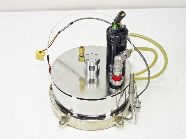 Top view of large stainless circular disc assembly with Clippard black pneumatic cylinder, red quick-disconnect fitting, and yellow thermocouple connector