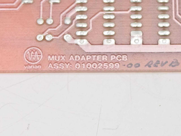 Varian MUX Adapter PCB label closeup — Assy 01002599-00 Rev B silkscreen marking