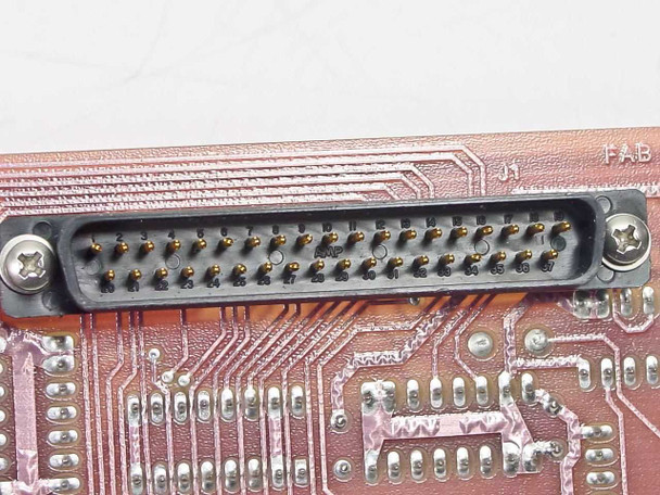 Varian 01002599 PCB — closeup of multi-pin D-sub edge connector (J1) with gold-pin contacts