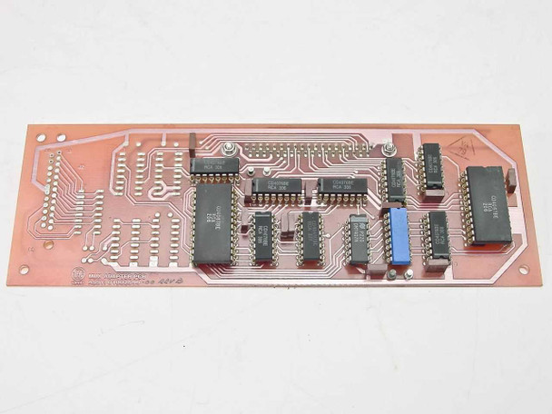 Varian 01002599 MUX Adapter PCB Card — component side showing ICs, DIP chips, and blue trimmer