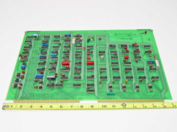 Varian 01000031 Rev H Control Logic Board – component side angled view with ruler showing board approximately 15 inches long