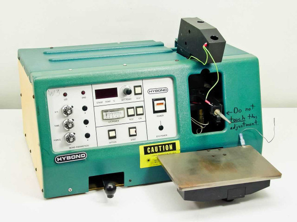 Hybond 512-10-41 Manual Ball Bonder front three-quarter view showing teal chassis, control panel, bond head with EFO wand, and extended work stage platen
