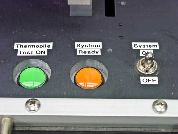 Front panel controls — Thermopile Test ON green button, System Ready orange indicator, and System ON/OFF toggle switch