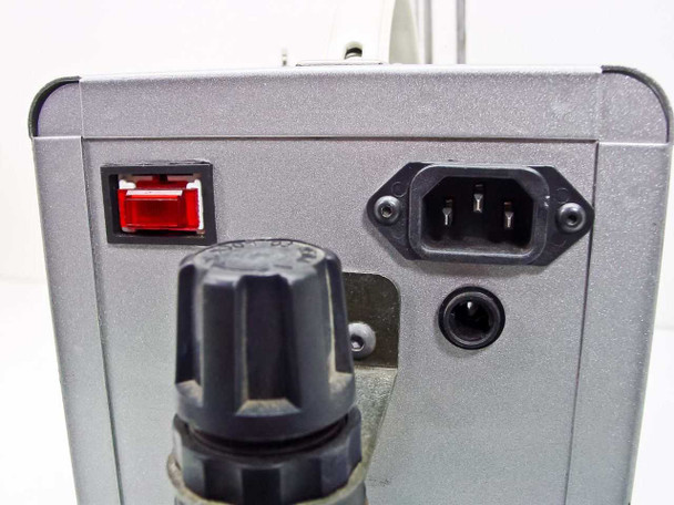 Rear/side panel of Ultramation OA-4 showing illuminated red rocker power switch, IEC C14 AC power inlet, and large black rotary pneumatic control knob