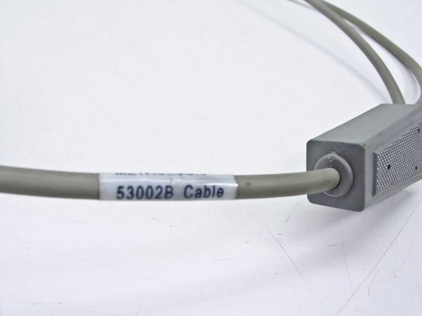 Metrologic 53002B cable label close-up on cable housing showing model number