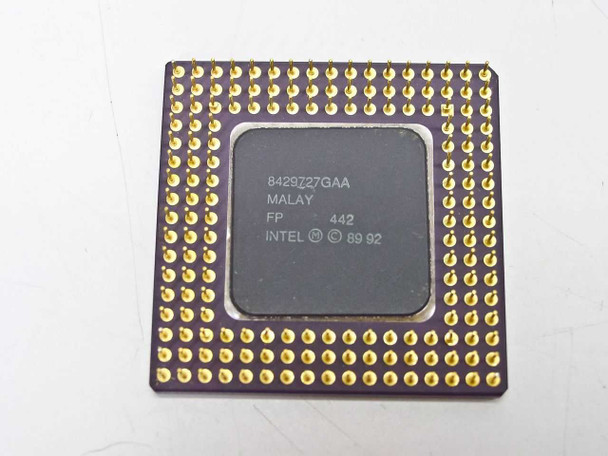 Intel 486SX-33 processor bottom view showing gold PGA pins array and Intel Malaysia date code markings