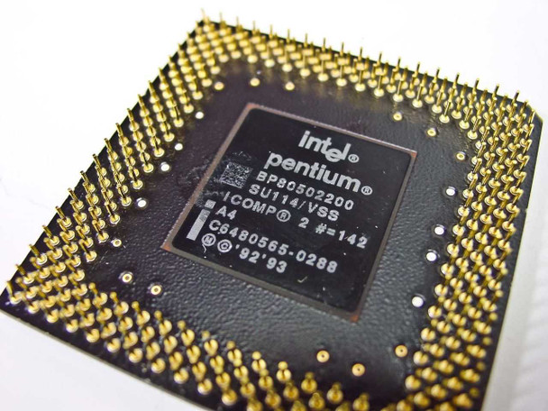 Intel Pentium BP80502200 SU114/VSS processor – underside close-up showing gold PGA pins and label with part number, stepping, ICOMP 2 rating, and 1992/1993 date codes