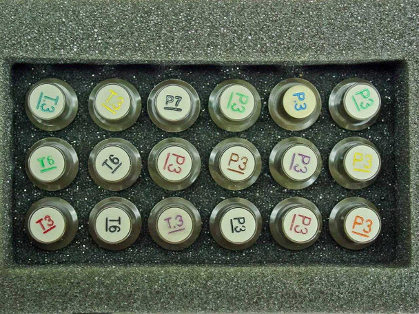 HP 92177W plotter organizer – close-up of 18 multicolored pen nibs seated in foam tray, labeled T3, T6, P3, P7 in various colors