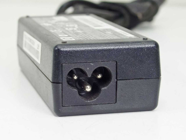 HP 463552-004 AC adapter — input end showing IEC C7 two-prong figure-8 AC inlet