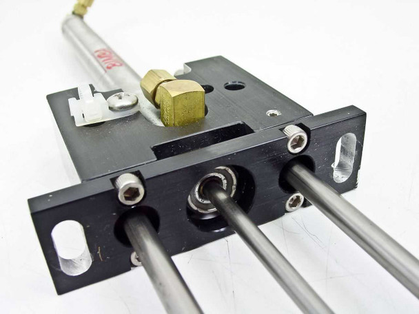 Bimba LT-025-D cylinder base block – bottom view showing three guide shaft exits, oval mounting slots, and hex socket cap screws