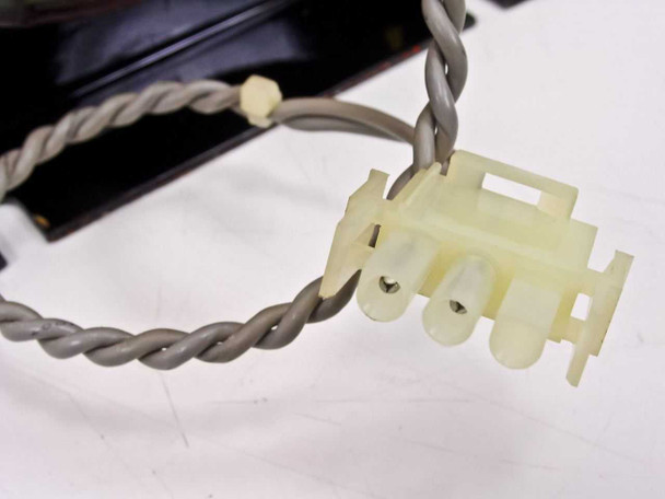 Close-up of secondary twisted-pair gray lead wire with small white molex-style connector on Sysmex PT-043 transformer
