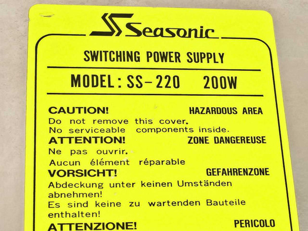 Seasonic SS-220 label close-up showing model SS-220 200W and multilingual hazard warnings