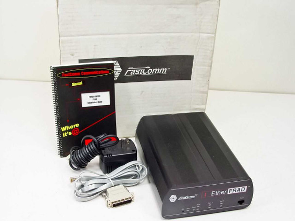 Fastcomm F9200-SS-FNE1-A1000 EtherFRAD open-box contents — unit, manual, power adapter, cable, and adapters with original Fastcomm box