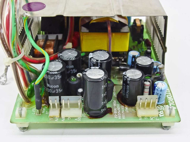 Radius 915-0028 power supply PCB close-up – Nicon 200µF 35V capacitors, yellow transformer, and Motorola PSM-7458-52 label visible on board edge