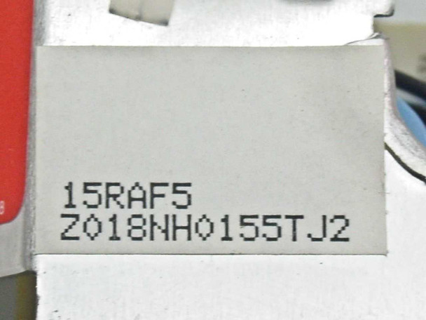 Radius 915-0100R label close-up — white label showing model number 15RAF5 and serial/lot code Z018NH0155TJ2