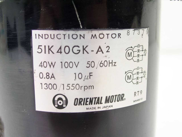 Oriental Motor 5IK40GK-A2 rating plate — 40W 100V 50/60Hz 0.8A 10µF 1300/1550 RPM Made in Japan label close-up