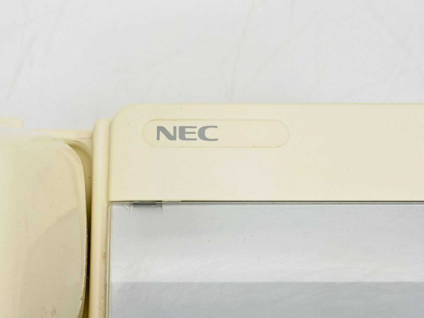 NEC ETJ-1HM-1 (SW) top corner close-up showing NEC logo and yellowed cream plastic housing
