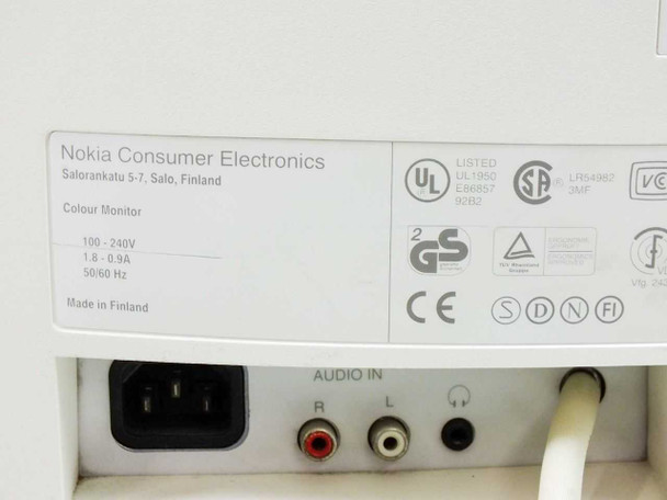 Nokia 447L rear panel close-up showing rating plate (100-240V, 1.8-0.9A, 50/60Hz, Made in Finland), IEC power inlet, and RCA plus 3.5mm audio inputs