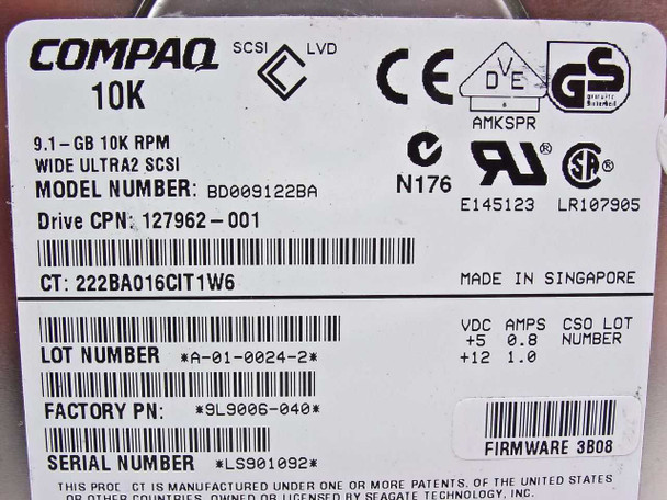 Seagate 9L9006-040 close-up of drive label showing model BD009122BA, 9.1GB 10K RPM Wide Ultra2 SCSI, Compaq CPN 127962-001, factory PN 9L9006-040, serial number LS901092, firmware 3B08, made in Singapore