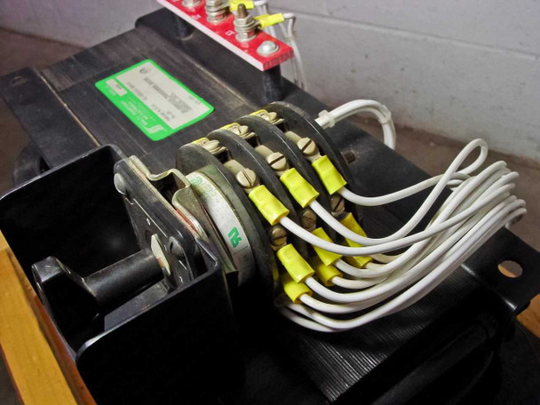 Quality Transformer Electronics 4690 — close-up of secondary tap winding connections showing yellow-labeled wire lugs on multi-position rotary tap switch stacks (positions 12, 11, 22, 21, 32, 31 visible)