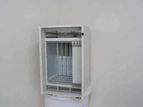 Cabletron MMAC Plus 9C114 14-slot chassis open front view showing empty card slots and backplane