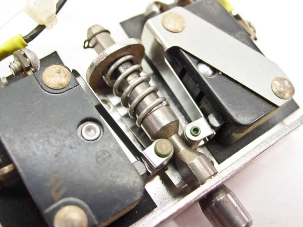 Micro Switch 9125 4AC2 internal mechanism close-up — spring plunger assembly, roller actuator, and sub-switch mounting detail