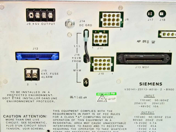 Siemens V30141 rear panel showing connector array including J9 +5V Output, J14 DC GND, J15 Ext. Fuse Alarm, J12 blue multi-pin connector, J16 +5VB from MSM, J10, J11 LCL, J13 MDF large multi-pin, J6, J17, J18 connectors, plus rating plate and Elgin Electronics label