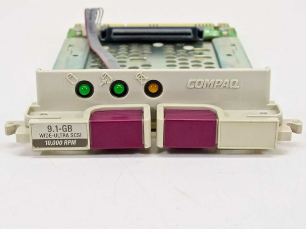 Compaq 199880-001 caddy front face showing 9.1 GB Wide Ultra SCSI 10000 RPM label, green and amber status LEDs, and purple handles