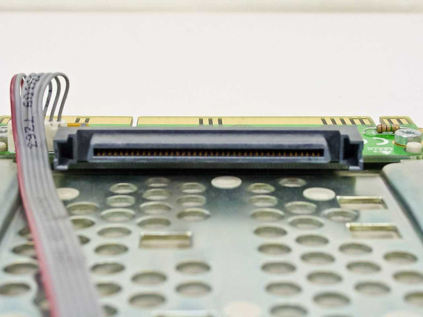 Close-up of 80-pin Wide Ultra SCSI connector on Compaq 199880-001 hard drive caddy PCB with ribbon cable slot visible