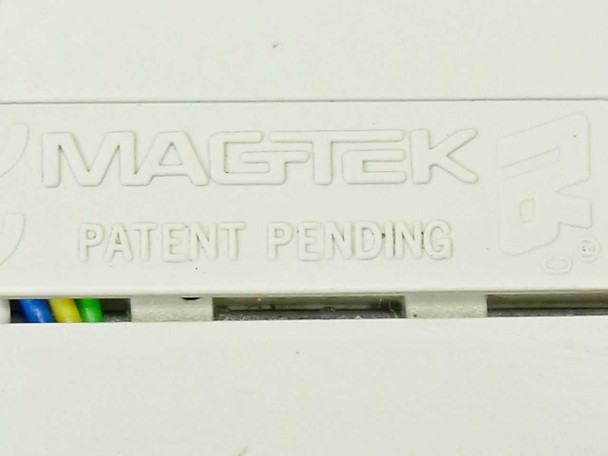MagTek label closeup showing brand name and Patent Pending marking on underside of reader