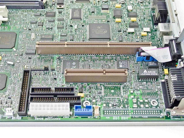 Compaq 296669-001 motherboard — closeup of IDE connectors, PCI-style slots, and processor board area with Dallas chip and Altera logic IC