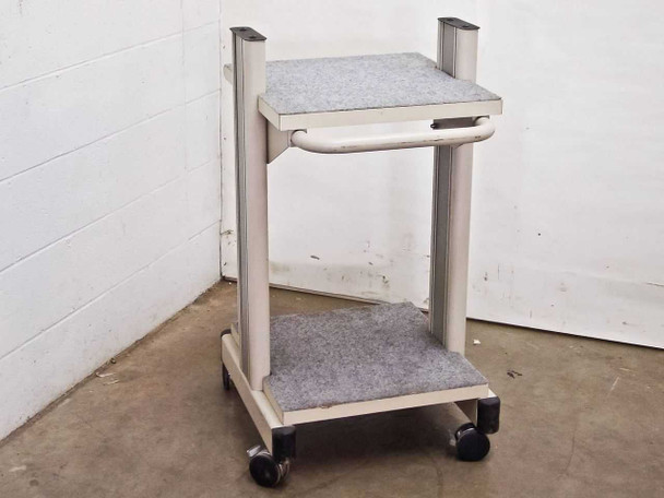 Unbranded white rolling cart with carpeted shelves — front-right three-quarter view showing adjustable top shelf bracket and handle