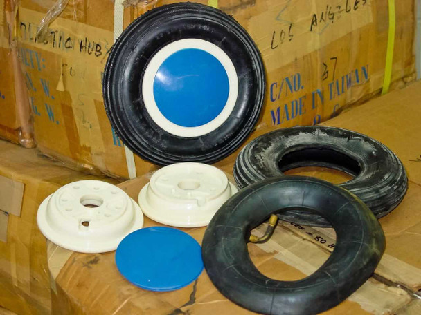 Cheng Shin SS201-02 200x50 tires, 200x47/50 inner tubes, white plastic hubs, and blue hub cap displayed on cardboard boxes