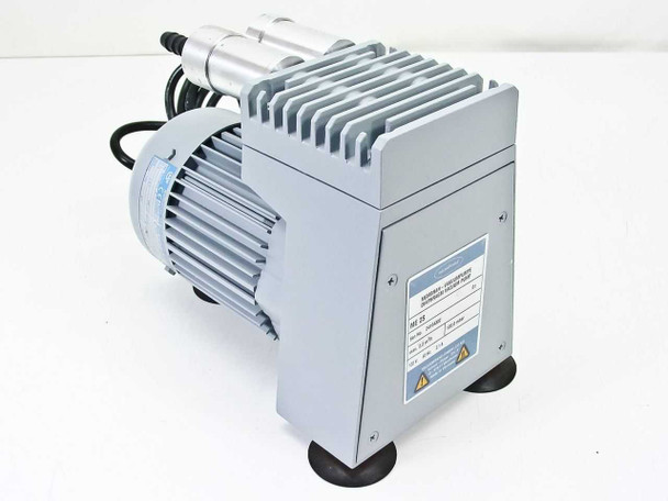 Vacuubrand ME 2S diaphragm vacuum pump — front-right three-quarter view showing gray housing, cooling fins, motor, and rating plate on side panel