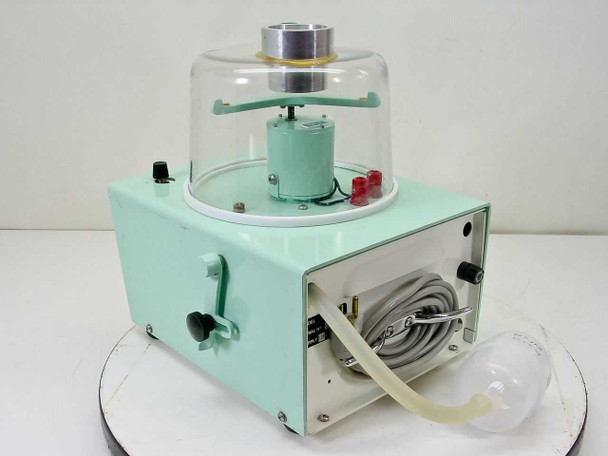 Mattson-Garvin Model 220 Air Sampler rear view — power cord coiled on rear panel, On/Off toggle switch on left side, glass dome and rotating arm assembly visible above