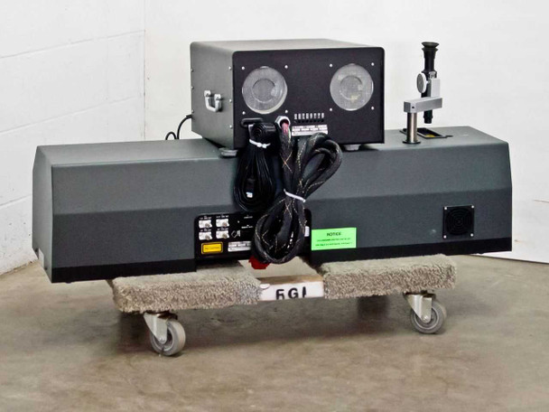 Beckman Coulter Delsa 440SX rear view showing bundled cables, power supply on top, and optical assembly at right on wheeled dolly