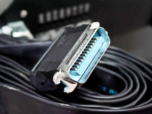 Close-up of blue Centronics-style ribbon cable connector from the Delsa 440SX cable bundle