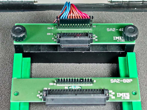 Close-up of SA2-40P and SA2-80P IMES interface PCBs — SA2-40P board showing CN-1 and CN-2 connectors with multicolor ribbon cable, SA2-80P board below with 80-pin SCSI-style connector