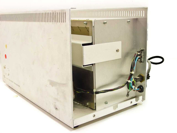 TCL 2110 Multiport Transceiver right-side and rear view showing teal/green chassis panels with surface scuffs and wear