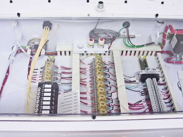 Interior electronics compartment of FSI ChemFill cabinet showing multiple terminal blocks, wiring harnesses, and control relay assemblies