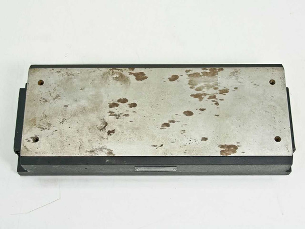 Automation Gages AG Linear Positioning Slide top-down view of metal carriage plate showing significant rust and oxidation spotting