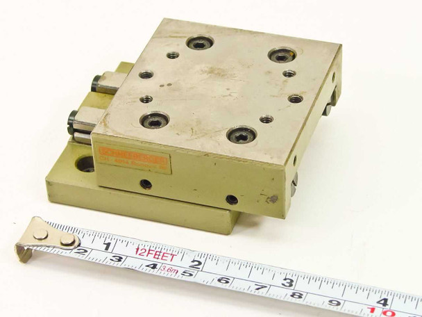 Schneeberger Rondal RF linear positioning table slide — top and front view with tape measure showing approximately 2.375 in platform width
