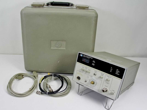 HP 436A Power Meter shown with gray hard carry case, coax cables, and accessories on white background