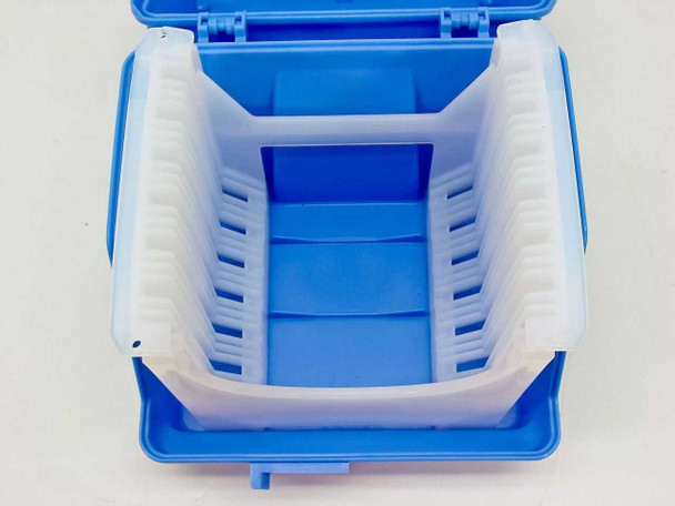 Top-down view into open Fluoroware E124-60 Robox case showing white A182-60MU 13-slot cassette with wafer slots clearly visible