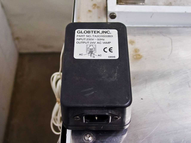 Globtek TA2CH000B01 power supply label showing Input 230V 50Hz, Output 24V AC 1A, CE marked, date code 0896