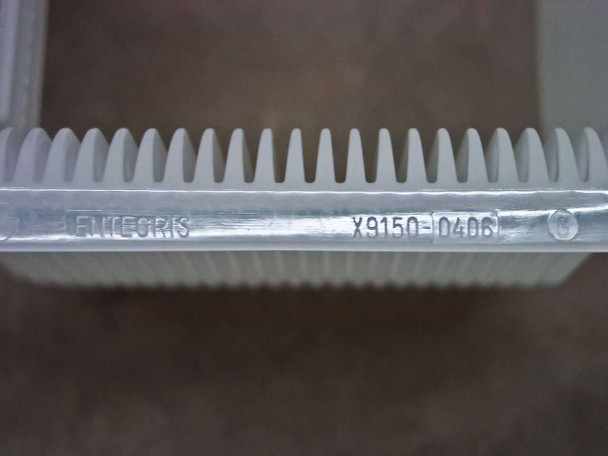 Entegris X9150-0406 label close-up on wafer carrier showing brand name ENTEGRIS and part number X9150-0406 molded into the edge rail
