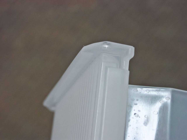 Entegris X9150-0406 wafer carrier – close-up of corner post and latch tab detail showing clear plastic construction